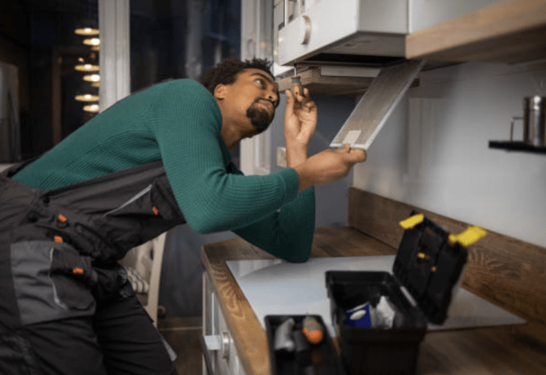 Technician repairing a Slim Hood