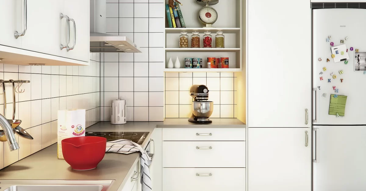 Stylish Kitchen Design with Built-in Induction Cooker, a Fridge and Wall Hood