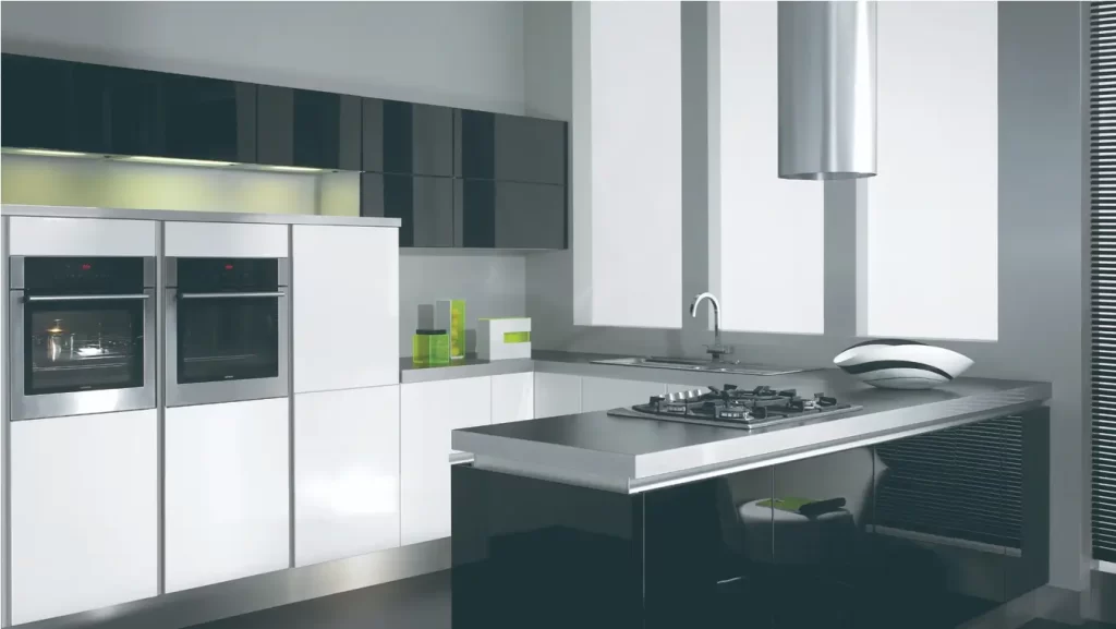 A Modern Kitchen with Matching Black and White Cabinets and Appliances