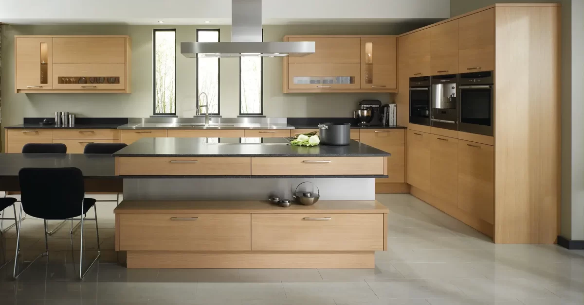 An Island Kitchen Design with Island Hood and Inbuilt Oven and Microwave