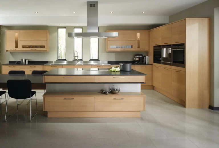 An Island Kitchen Design with Island Hood and Inbuilt Oven and Microwave