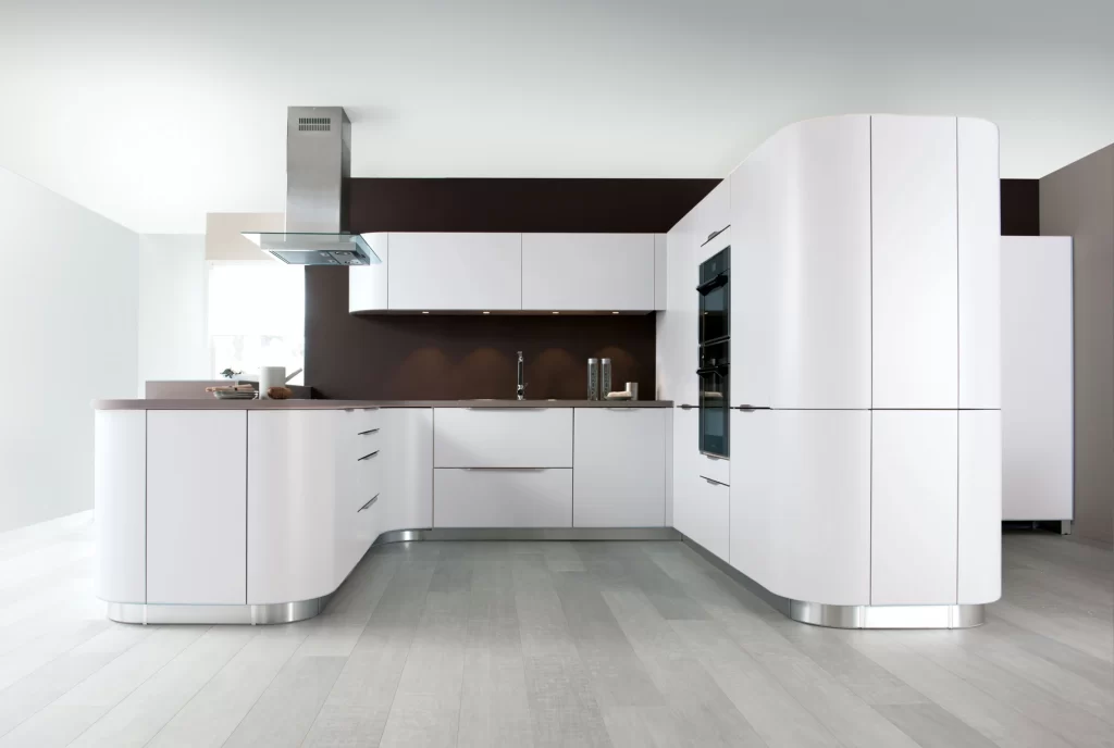 Open Kitchen Design with a White Finish and Black Appliances